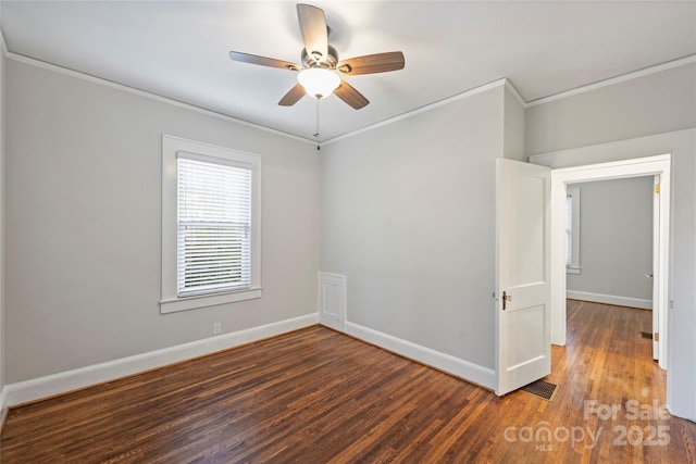 unfurnished room featuring ceiling fan, ornamental molding, and dark hardwood / wood-style flooring