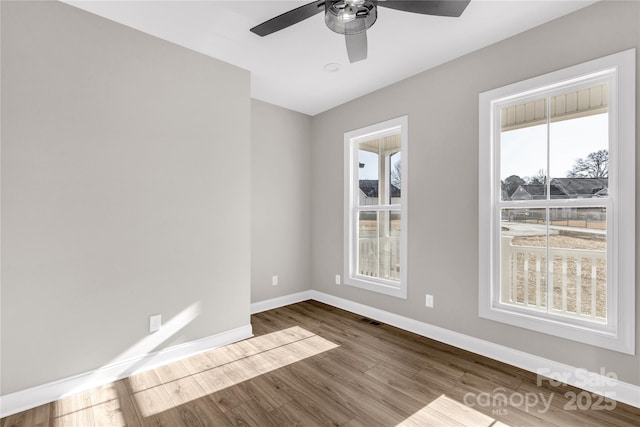 spare room featuring ceiling fan and wood-type flooring