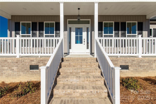 doorway to property featuring a porch