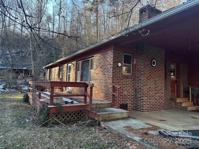 view of side of property with a deck