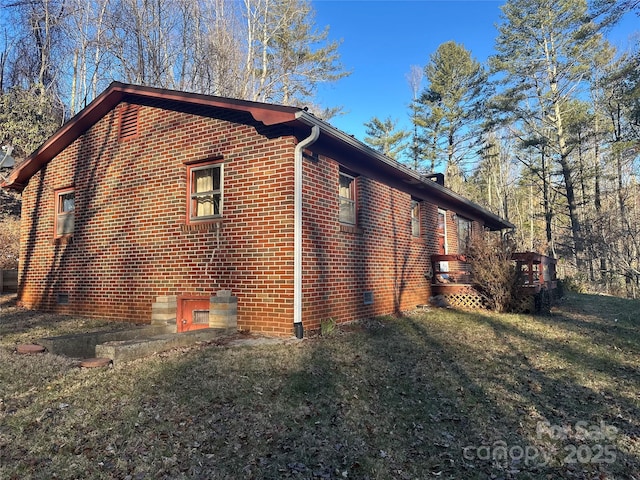 view of home's exterior with a yard