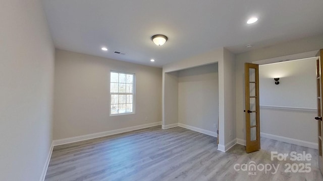 unfurnished bedroom featuring light hardwood / wood-style flooring