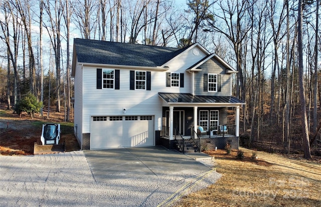 view of front of house with a garage and covered porch