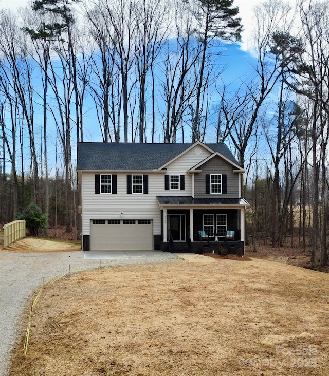 view of front of property with a garage and covered porch