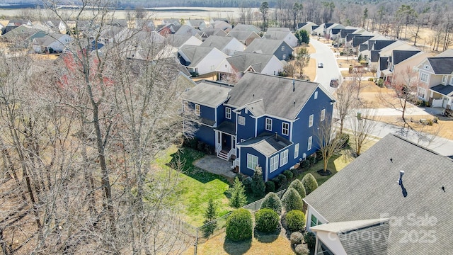 birds eye view of property with a residential view