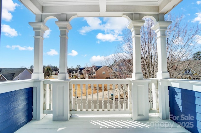 exterior space with covered porch and a residential view