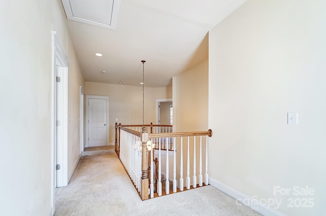 hall featuring light carpet, baseboards, and recessed lighting