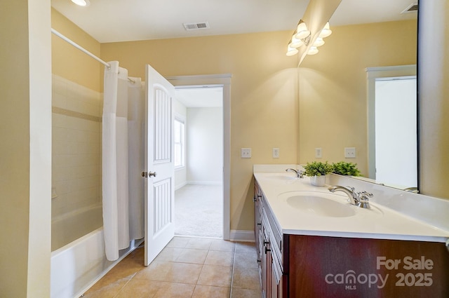 full bathroom featuring tile patterned flooring, visible vents, a sink, and double vanity