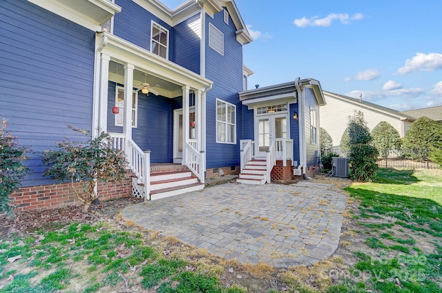 exterior space with a ceiling fan, a patio area, crawl space, and central AC