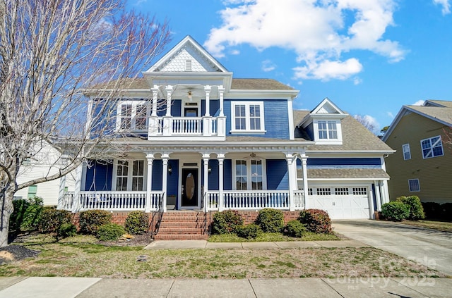 neoclassical / greek revival house with covered porch and concrete driveway