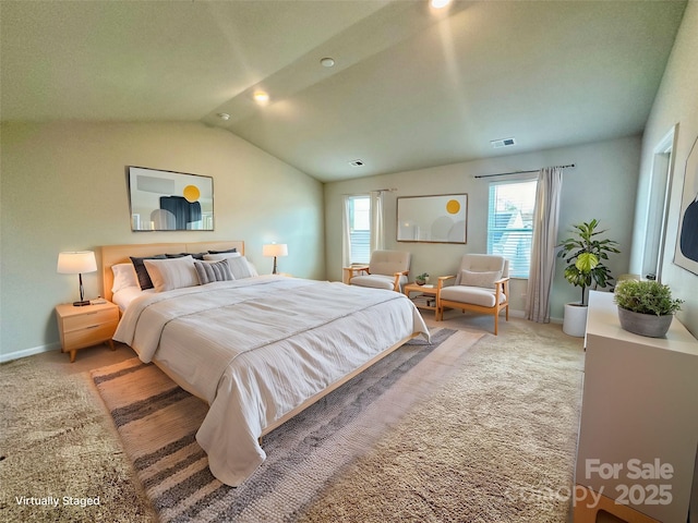 bedroom with carpet and vaulted ceiling