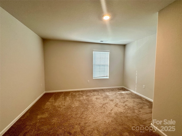 unfurnished room featuring carpet floors