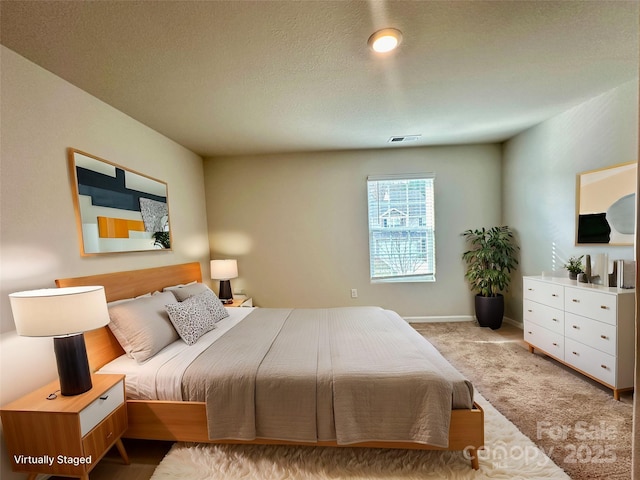 bedroom featuring light colored carpet