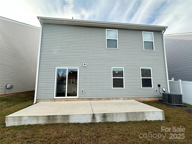 back of house with central AC and a patio