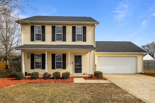 front of property featuring a garage and a front lawn