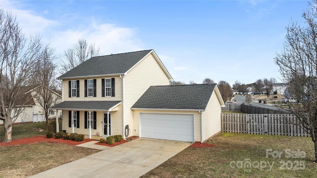 view of front facade featuring a front yard, a garage, and a porch