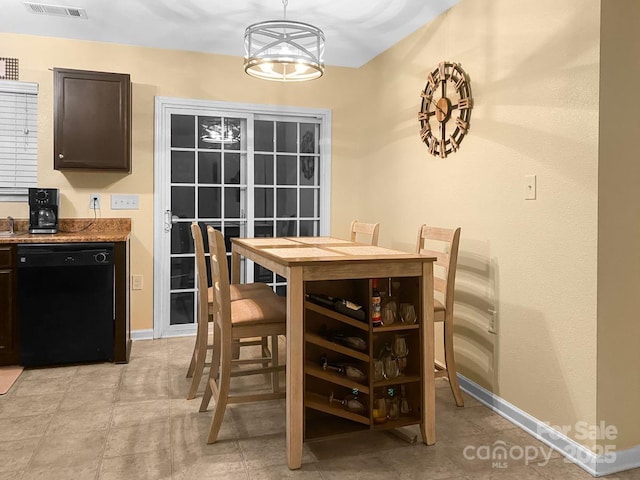 dining area with a notable chandelier