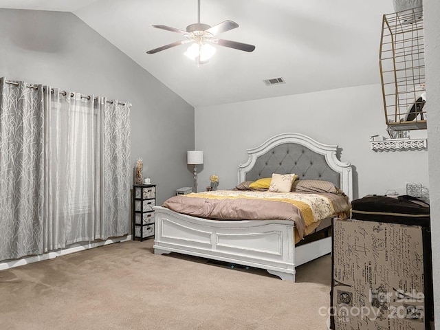 carpeted bedroom with ceiling fan and lofted ceiling