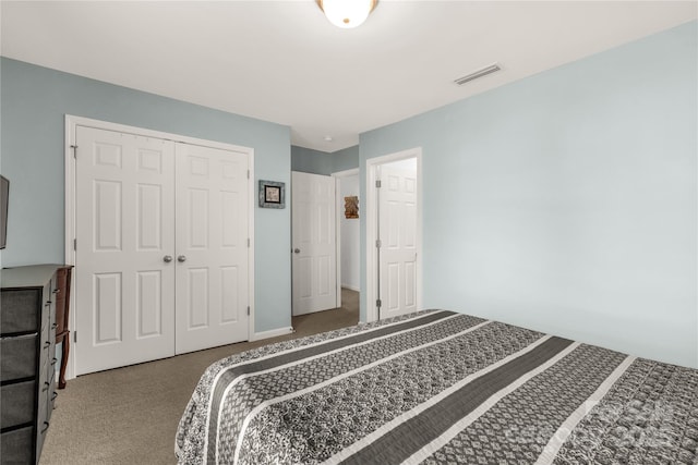 bedroom with a closet and carpet floors