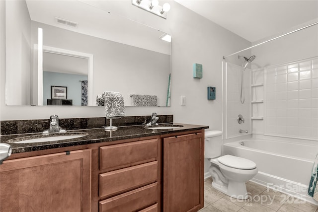 full bathroom with vanity, toilet, tile patterned flooring, and shower / washtub combination