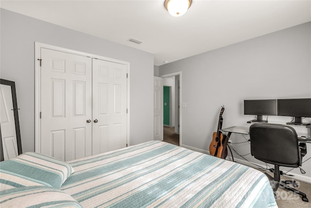 bedroom featuring a closet and carpet floors