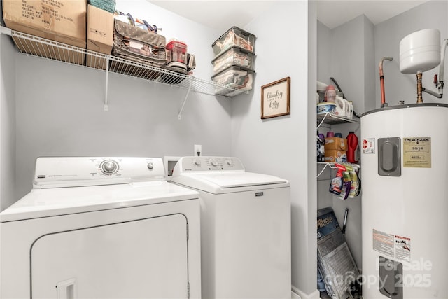 laundry area featuring water heater and independent washer and dryer