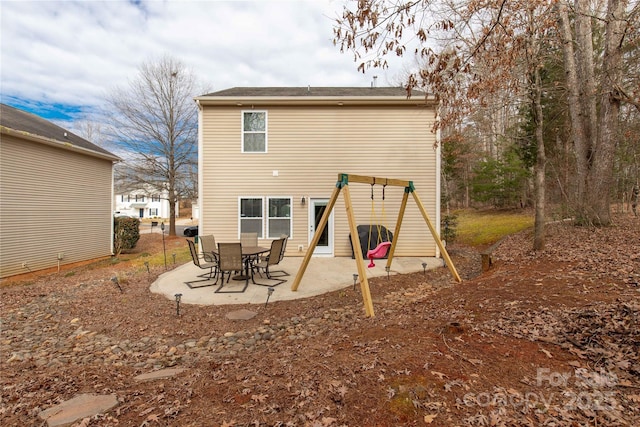 rear view of house with a patio