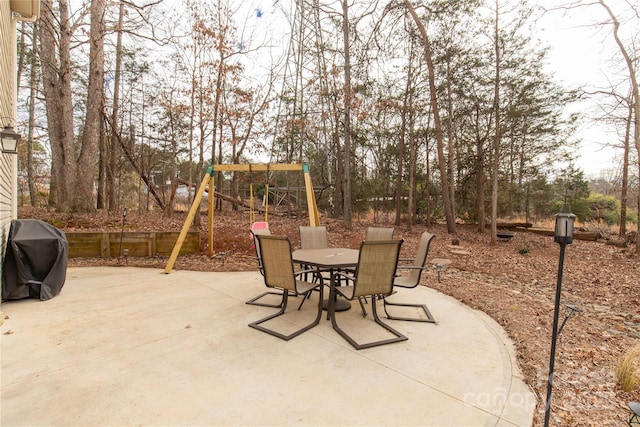 view of patio / terrace featuring a grill and a playground