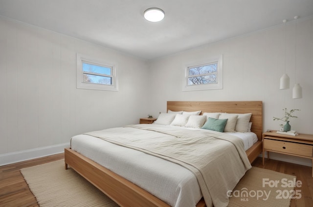 bedroom with hardwood / wood-style floors