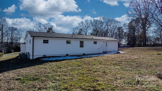 rear view of house with a lawn