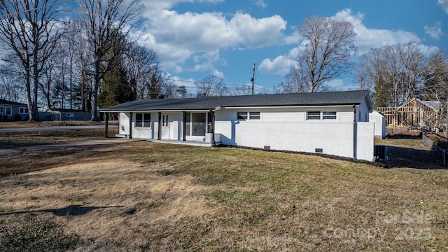 single story home with a playground, covered porch, brick siding, crawl space, and a front lawn