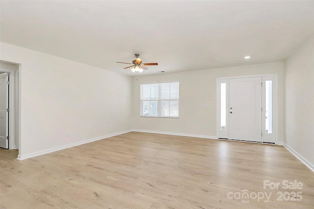 entryway featuring ceiling fan and light wood-type flooring