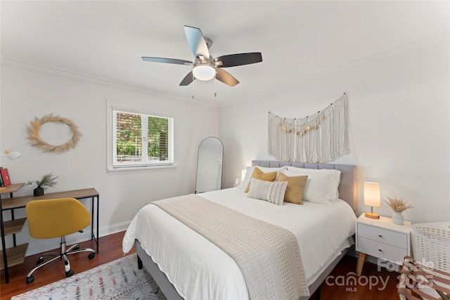 bedroom featuring ceiling fan, dark hardwood / wood-style floors, and crown molding