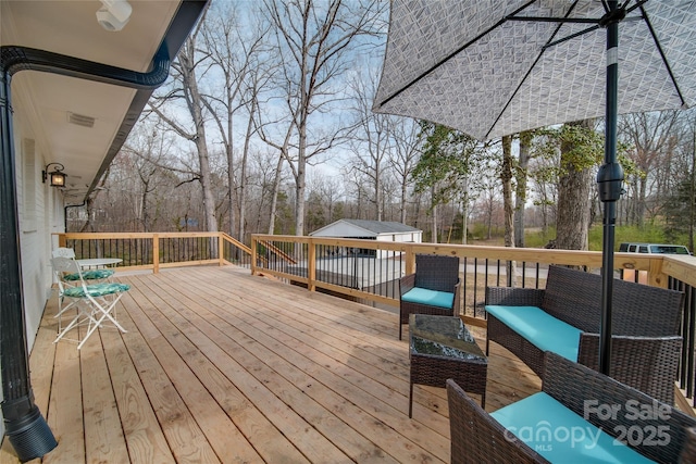 wooden deck featuring an outdoor hangout area