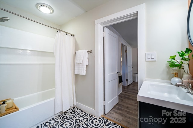 bathroom with vanity, wood-type flooring, and shower / bath combo