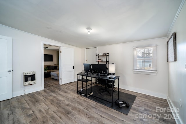 office with vaulted ceiling, heating unit, and wood-type flooring