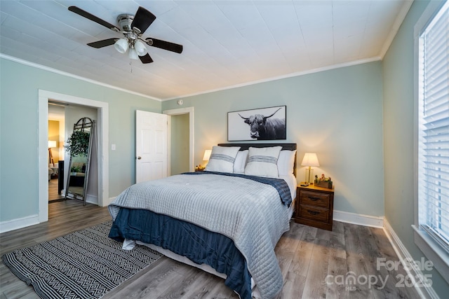 bedroom with ceiling fan, dark hardwood / wood-style flooring, and crown molding