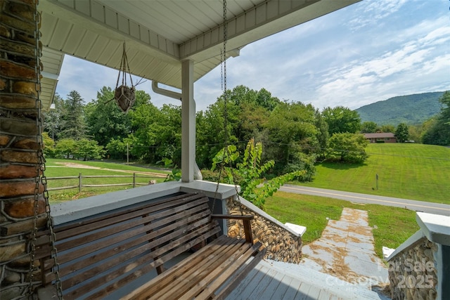 wooden deck with a mountain view