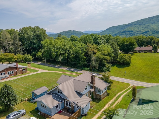 birds eye view of property featuring a mountain view