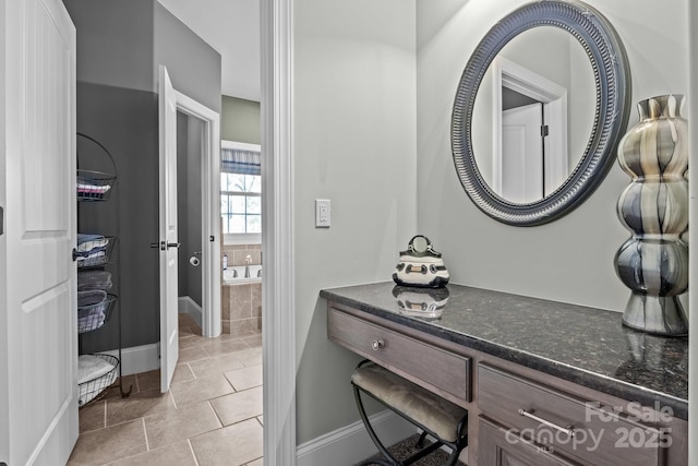 bathroom with vanity and tile patterned flooring