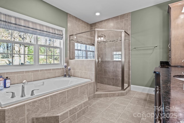 bathroom featuring sink, separate shower and tub, and tile patterned flooring