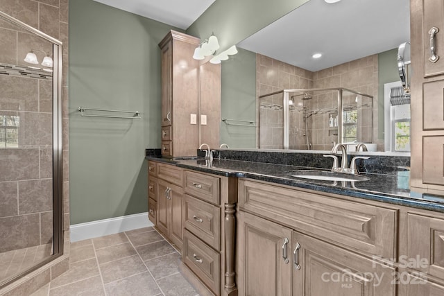 bathroom featuring vanity, tile patterned flooring, and walk in shower