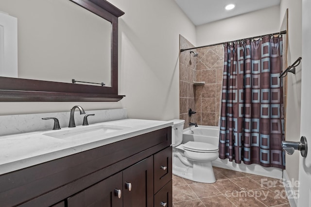 full bathroom featuring shower / bathtub combination with curtain, vanity, toilet, and tile patterned floors