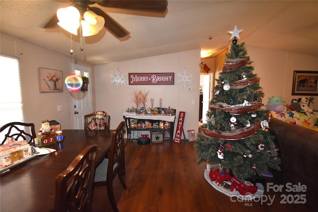 dining room featuring a ceiling fan, lofted ceiling, and wood finished floors