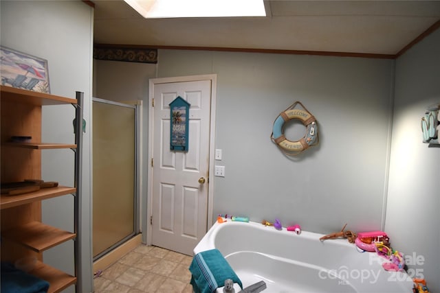 bathroom featuring a shower stall and a garden tub