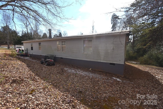 view of home's exterior featuring central air condition unit