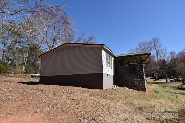 view of home's exterior with metal roof