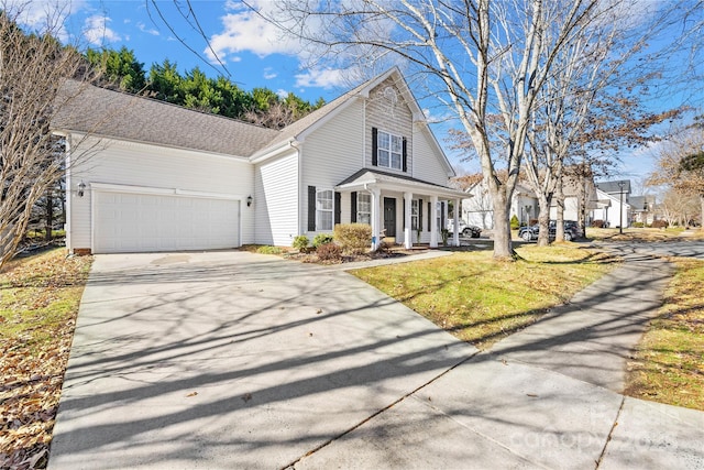 front facade featuring a front lawn and a garage