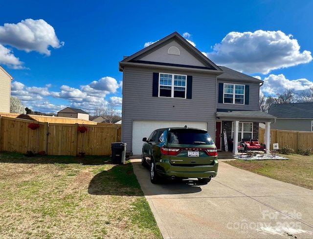 front of property featuring a garage and a front yard