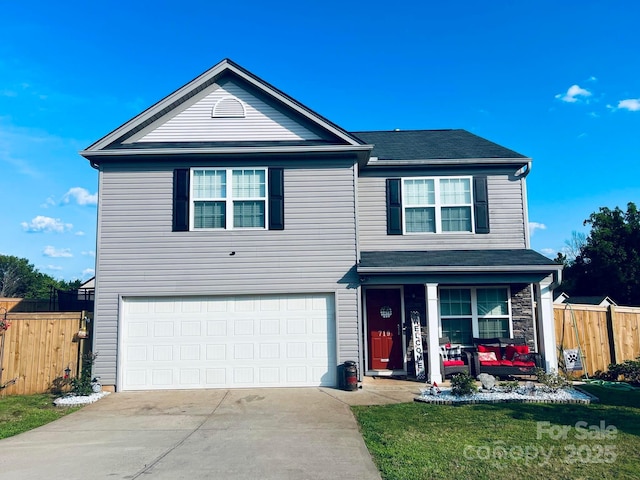 front of property featuring a garage and covered porch